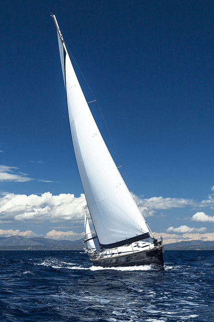 Sailing boat crossing calm sea