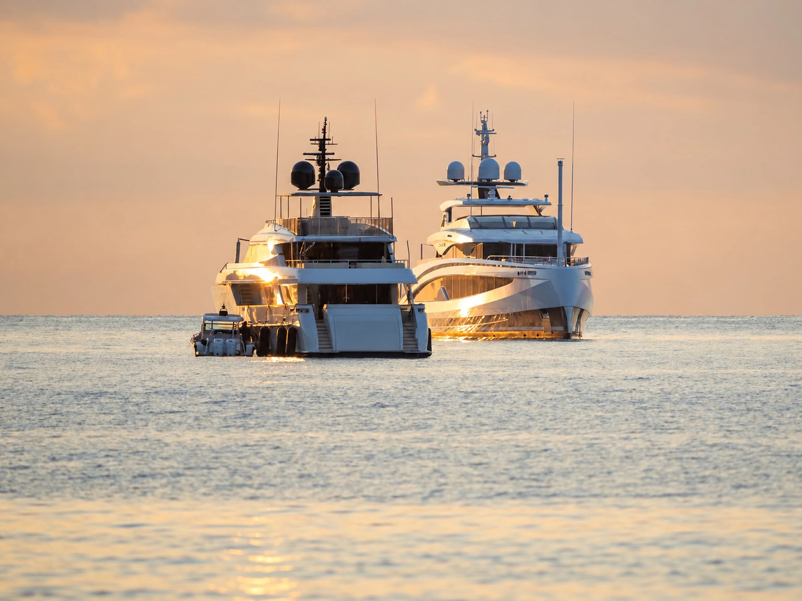 Luxury yachts at golden hour